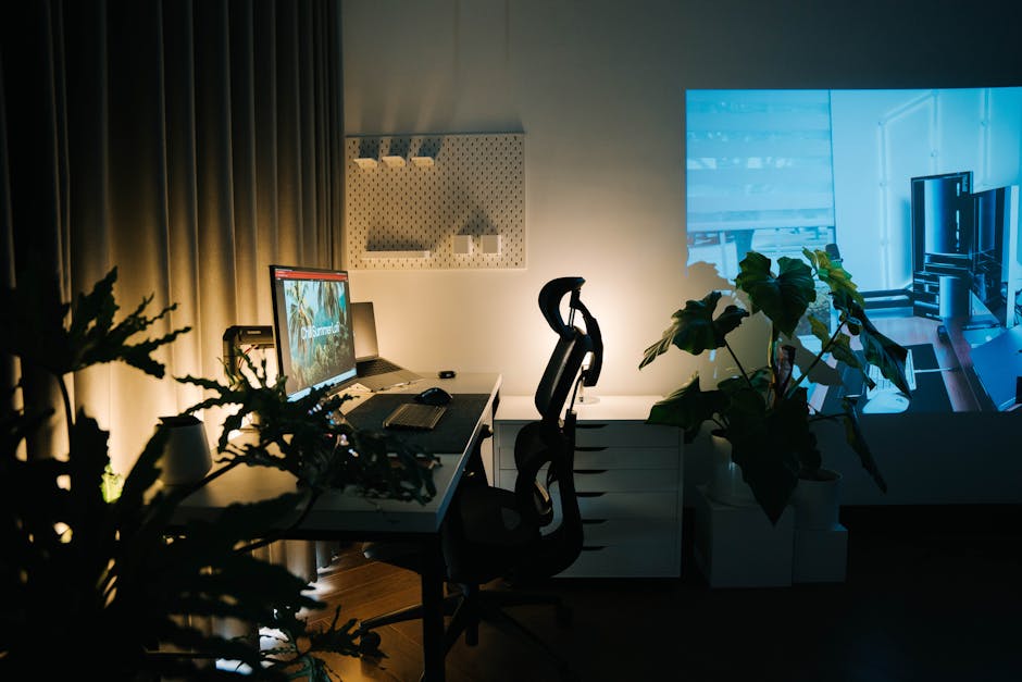 Stylish home office setup with ambient lighting and houseplants, perfect for productivity and relaxation.